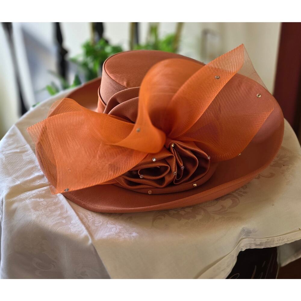 NIB Tania Bella burnt‎ orange hat, with satin rose and mesh, gems